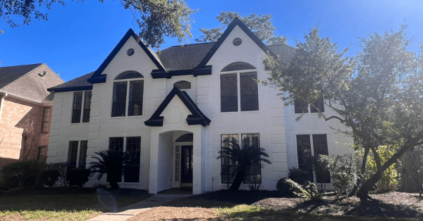 a home following the exterior painting trends of painting your brick home white with black trim_That 1 Painter Pearland