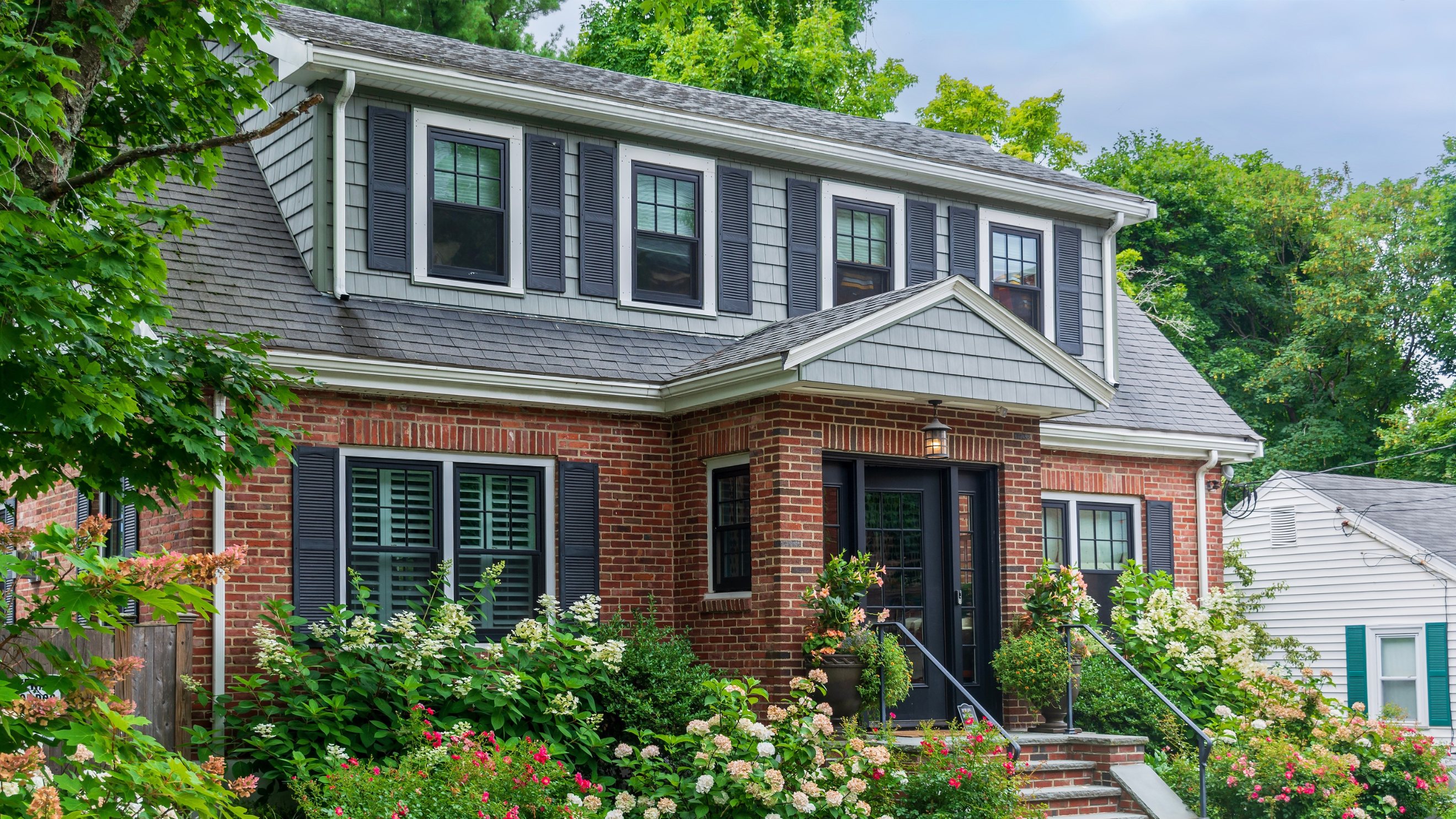 a two story brick home in Pennsylvania painted by professional painters in bethel park _ that 1 painter northwest pittsburgh
