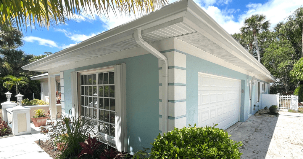 a professionally painted light blue home painted by that 1 painter treasure coast professional painters