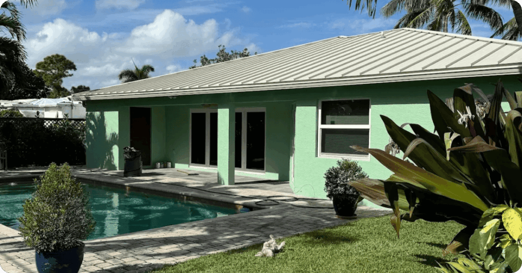 exterior painting with turquoise house and palm trees for that 1 painter