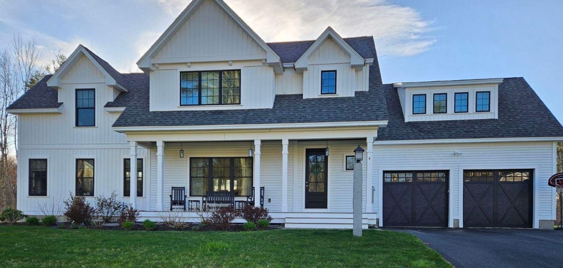 large white home with two car garage and pillar professional painter _That 1 Painter Salt Lake City