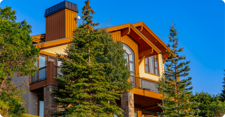exterior repainting of a home with panels and brick and trees for that 1 painter Salt lake city