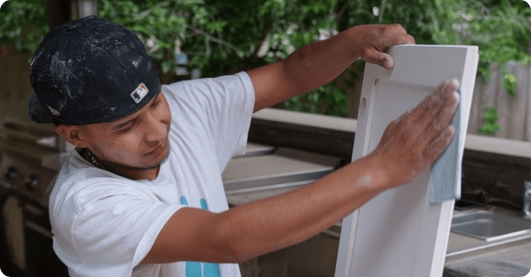 professional painter with cabinet painting outside with cloth for That 1 Painter Salt Lake City