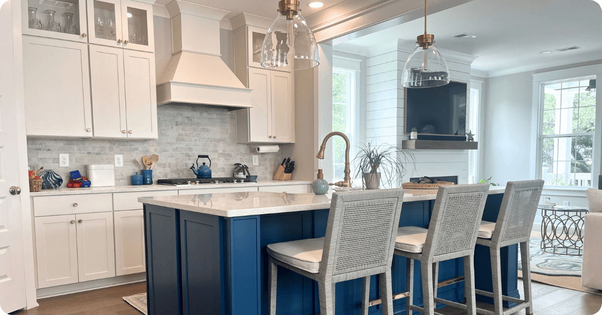 Interior-painters-in-Sarasota-paint-a-luxury-home-with-a-blue-island-and-white-cabinets-for-that-1-painter.png