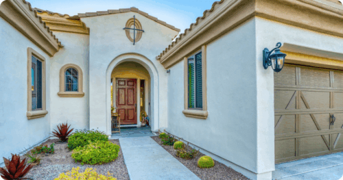 Beautiful cream house with yellow trim painted by professional painters in Chandler, AZ
