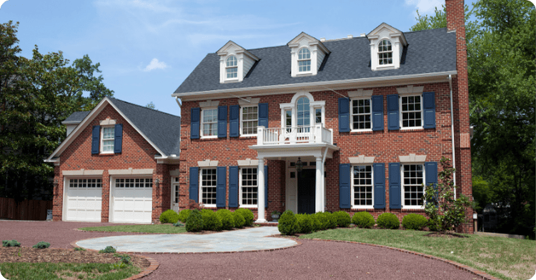 red brick home with pillars and blue exterior paint painted shutters that 1 painter shreveport