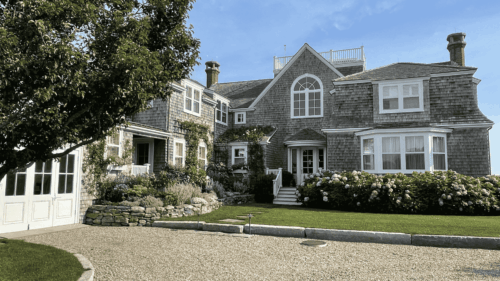 Beautiful Cape Cod style gray and white house with crisp white trim painted by professional painters in Scarborough, Maine.