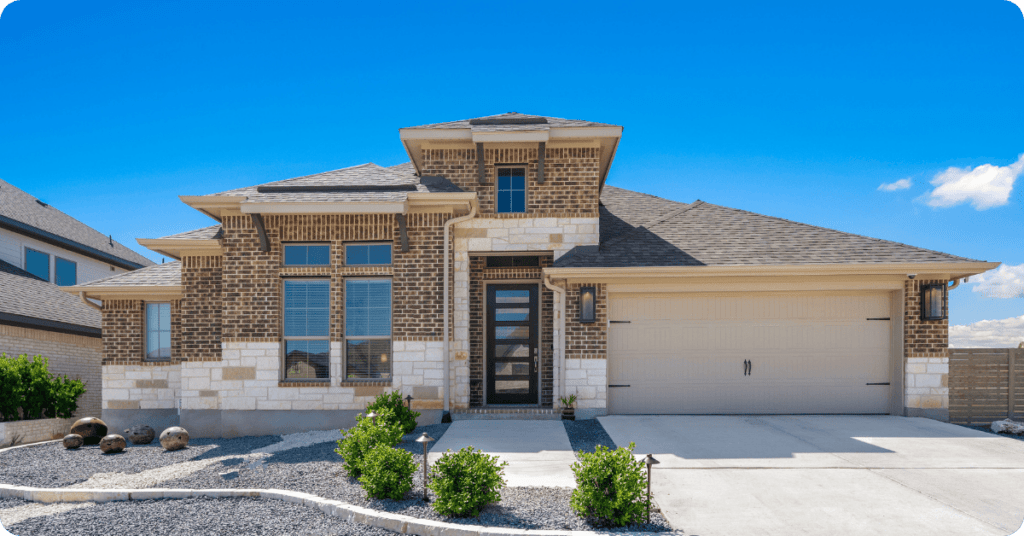 brick home with painters in southlake