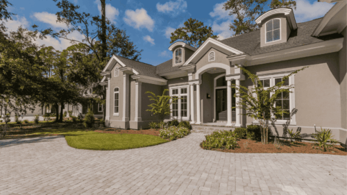 Beautiful Home with tan exteriors and white trim painted by professional painters in Valdosta, Florida