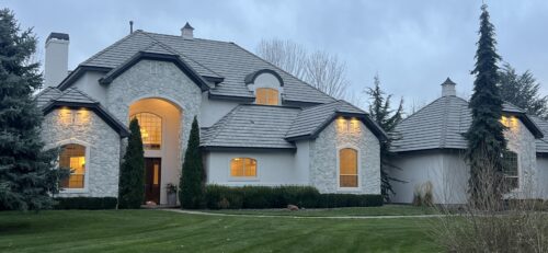Beautiful white house exteriors with dark trim painted by professional painters in Garden City, ID