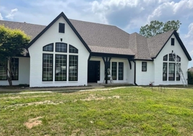 the exterior of a white brick home painted by a professional brick painter in tulsa, ok_that 1 painter