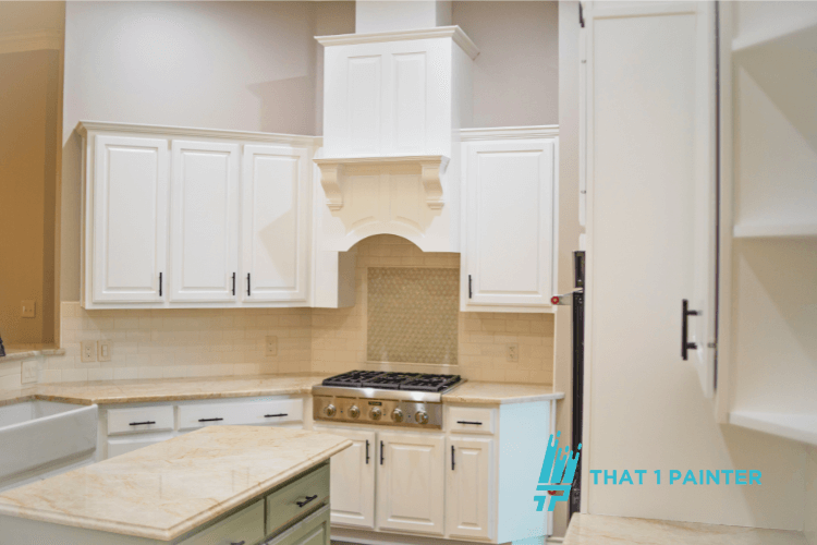 A beautifully renovated kitchen with freshly painted white cabinets, showcasing professional kitchen cabinet painting by That 1 Painter. This image highlights the top-tier painting services provided by North Minneapolis Interior Painters, transforming kitchens with precision and care, delivering the best professional painting services in North Minneapolis, Minnesota.