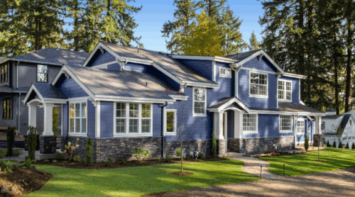 Detailed white trim painting on a blue exterior home by a professional painter in Edina, Minnesota