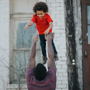dad-throwing-son-in-air