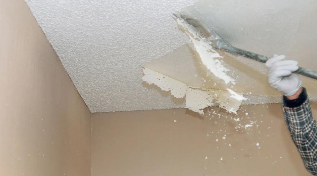 Popcorn ceiling being removed by That 1 Painter.