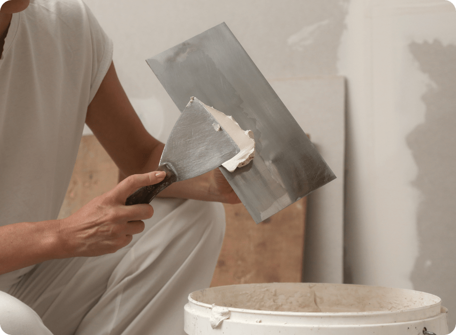 professional painter prepping for drywall repair before a paint job starts for that 1 painter